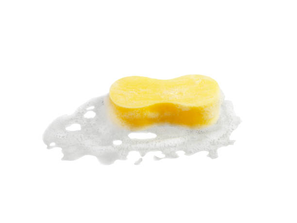 istock Yellow cleaning sponge in soap foam on white background isolation 1397044033