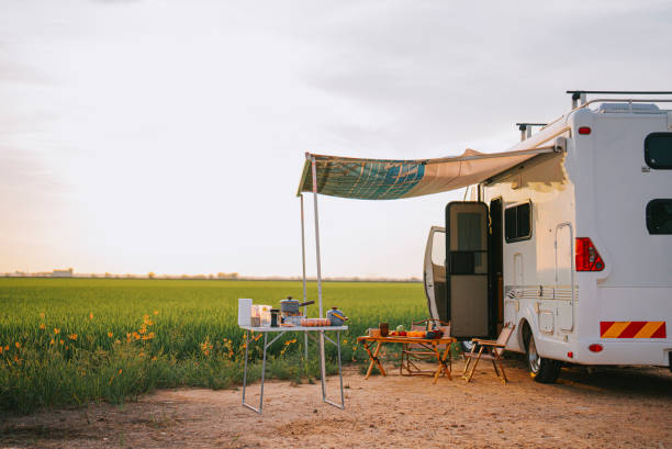 istock Motor home campervan park at rice paddy field during sunset 1397044793