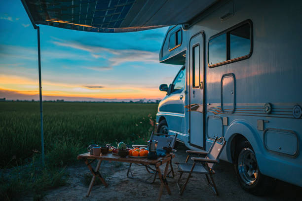 istock Motor home campervan park at rice paddy field during sunset 1397044804
