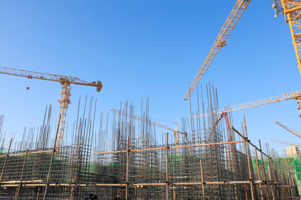 istock the construction worker's tower crane, Residential buildings are under construction 1397049554