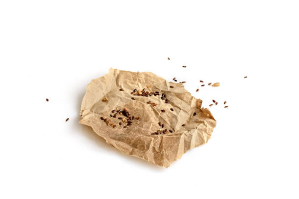 istock Baking paper in oil and sesame seeds on white 1397050710