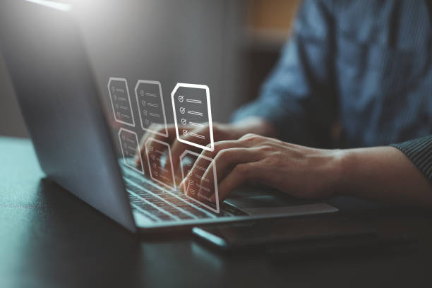 istock Document management concept with icons on virtual screen, ERP, Businessman working on laptop computer with electronics document information files. 1397050843