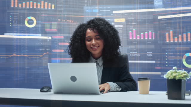 Office Manager with Animated Virtual Background: Businesswoman Sitting at a Desk Working on Laptop Computer. Black Female Working with Big Data Finance Analysis. 360 Degree Shot. Camera Moving Around.