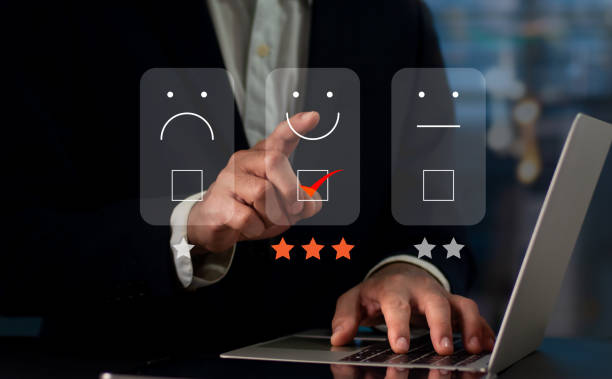 istock On the virtual screen, a businessman presses the face smiling emoji. Concept for evaluating customer service. User experience or customer satisfaction research can be conducted via a survey, poll. 1397051955