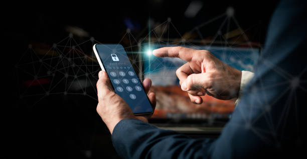 istock Hacking a Phishing mobile phone with a password to access a smartphone, internet security issues, and fraud are all concepts.A businessman with a mobile phone and a laptop computer has a safe account. 1397052042