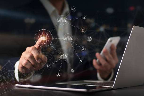 istock To efficiently handle files, a guy uses a mobile phone's virtual Global Internet connection metaverse, a Document Management System, an online documentation database, and process automation. 1397052053