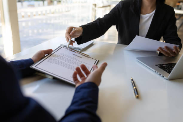 istock Man explaining resume and answering questions while interviewing new employees. 1397052978
