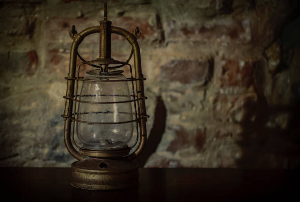 istock Kerosene lamp on an old vintage background. 1397054034