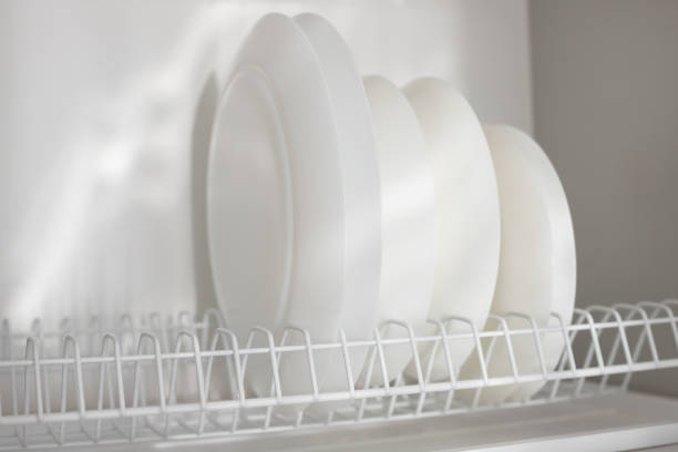 istock white clean plates on the shelf in the kitchen 1397056488