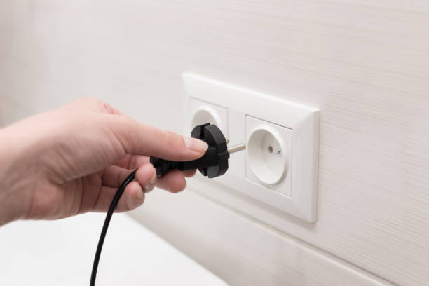 istock cord with plug from the electrical device to the socket. close-up 1397056571