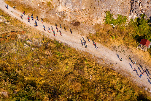 Mountain runners climbing mountain trail on ultra marathon event, Orehovo, Rhodope mountains, Bulgaria