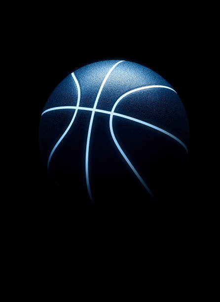 istock 3D rendering of basketball ball against black background. Graphical element with abstract concept of sport equipment 1397057513