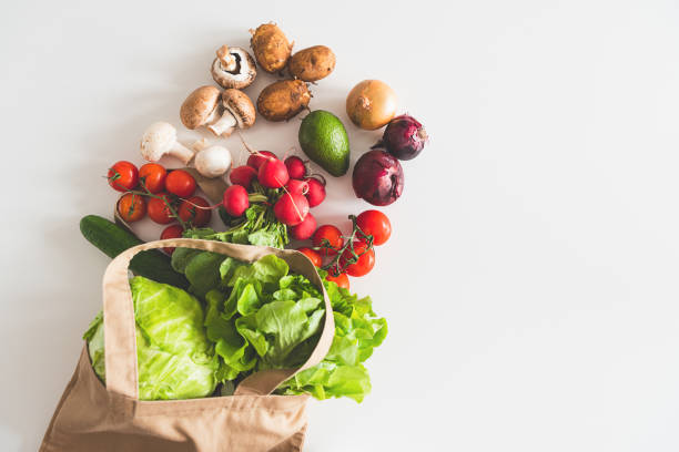 istock Eco friendly natural textile bag with organic vegetables. Top view 1397057588