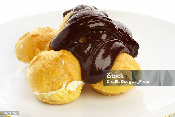Fresh Profiteroles With Hot Chocolate Sauce Stock Photo - Download Image Now - Baked Pastry Item, Cake, Chocolate