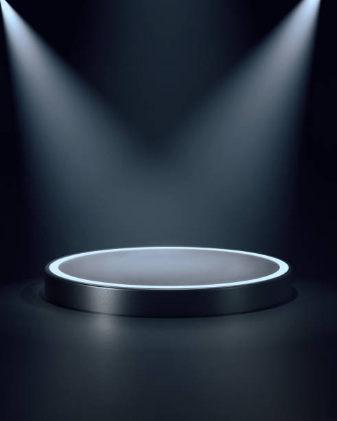 istock Low round podium lit by pair of spotlights from top corners. 3d computer graphic template of displaying place for your products. Blank template 1397057712