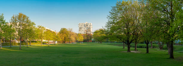 istock Large Meadow with Arabic Arc Park in Munich looking south 1397058801