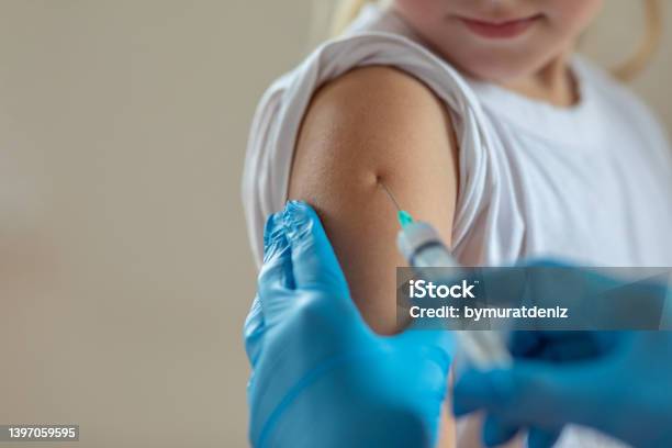 Child Getting Vaccination Stock Photo - Download Image Now - Tetanus, Vaccination, Deltoid