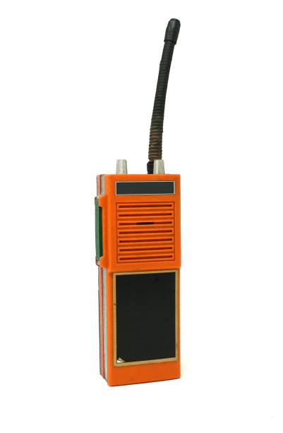 walkie talkie radio vintage orange Old grunge walkie-talkie phone with the antenna in a vertical picture. (vintage style) transceiver stock pictures, royalty-free photos & images