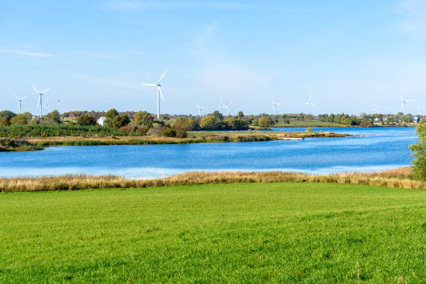 istock Wind farm in a rural landscape crossed by a river 1397060787