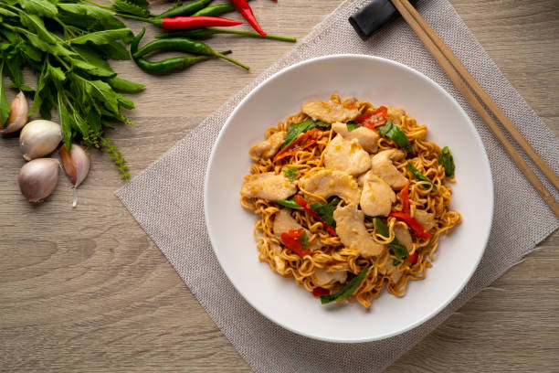 istock Spicy stir fried instant noodle with sliced chicken breast 1397062423