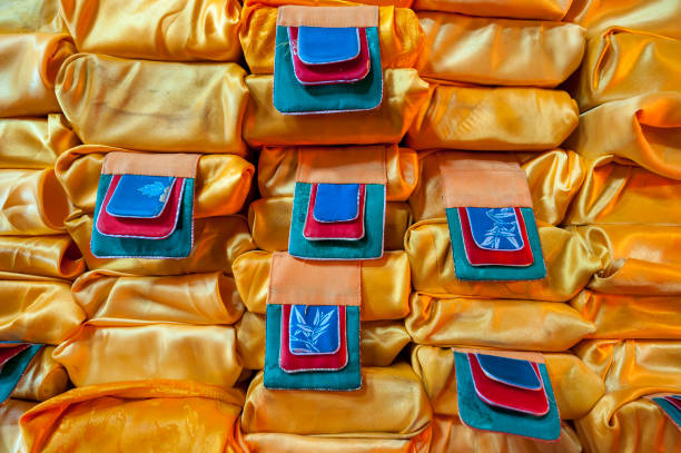 Close-up of Buddhist scriptures wrapped in orange cloths in a monastery in Mongolia, Central Asia