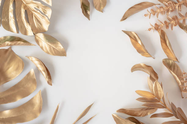 istock Gold tropical palm leaves Monstera on white background. Flat lay 1397065987