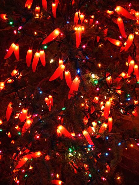 Photo of a Christmas tree decorated with jalapeno style christmas lights.