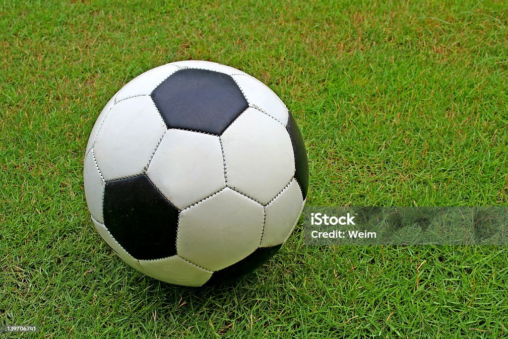 Soccer Ball A soccer ball on grass. Indoor Soccer Stock Photo