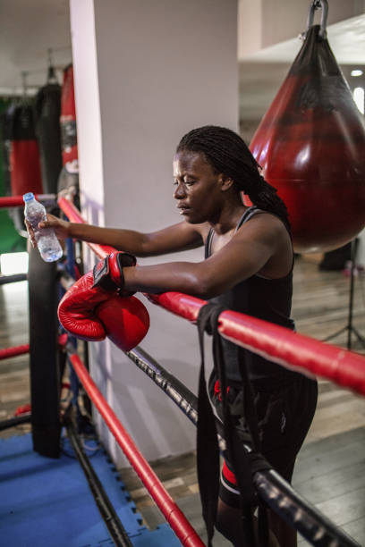 istock Strong black woman boxing 1397067599