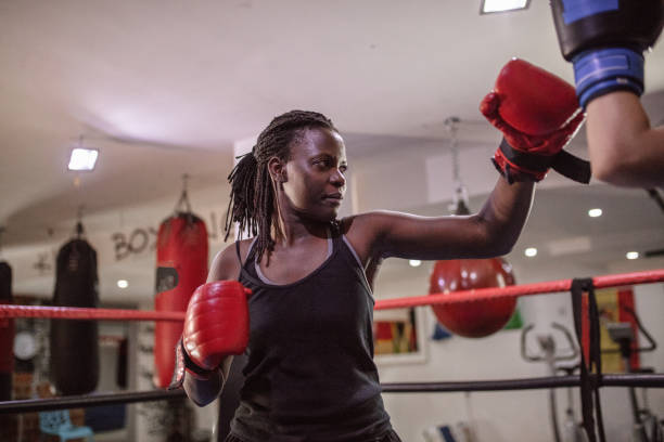 istock Female boxer training with her trainer in the ring 1397068369