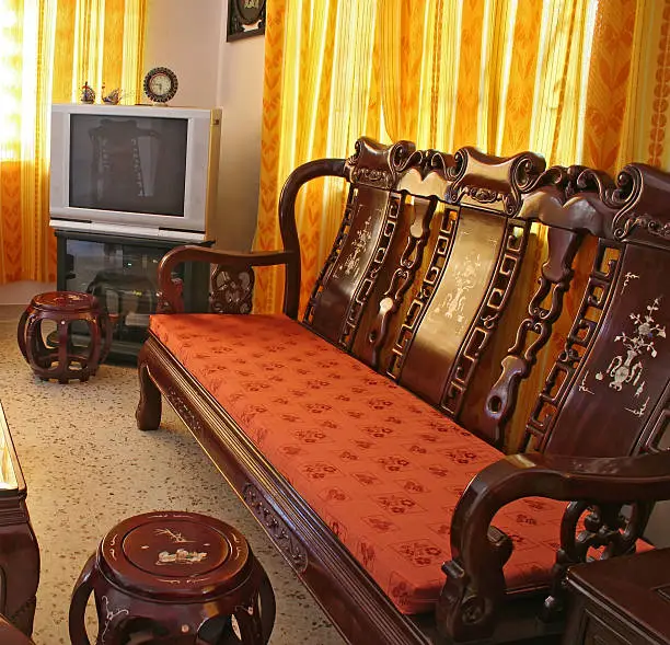 Living room furnished with antique Chinese rosewood furniture.