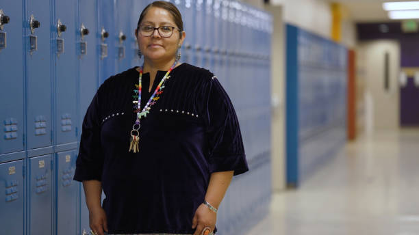 mature teacher at a school corridor - native american north american tribal culture women mature adult imagens e fotografias de stock