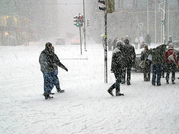 neve molto forte in città - rear view winter blizzard nordic countries foto e immagini stock
