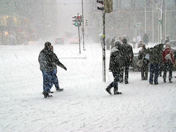 People walking between apartment buildings, winter night.