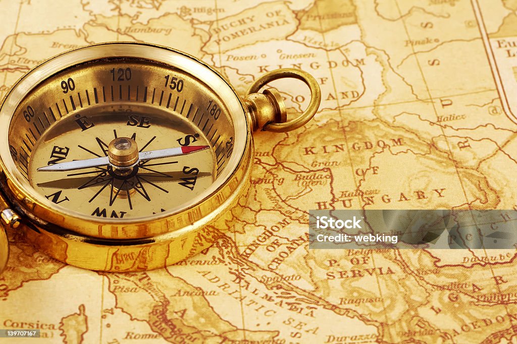 Compass Photo of a Compass on a Map Acute Angle Stock Photo