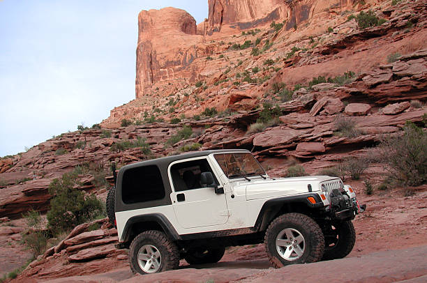 Jeep Rubicon Offroad II Jeep Rubicon off road near Moab, Utah. off road vehicle photos stock pictures, royalty-free photos & images