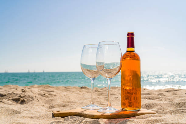 Rose wine at the beach stock photo