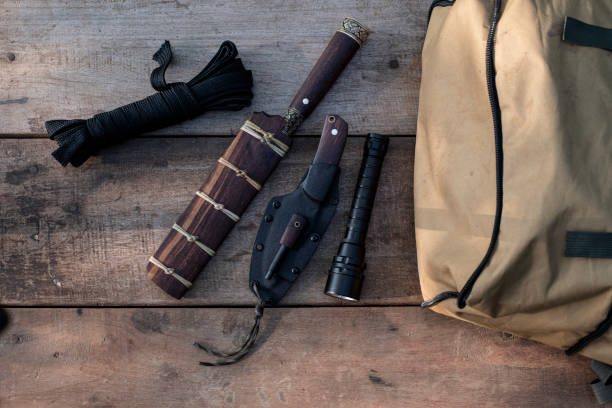 istock A knife with equipment for survival in the forest 1397074016