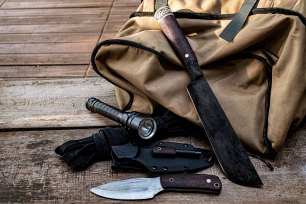 istock A knife with equipment for survival in the forest 1397074021