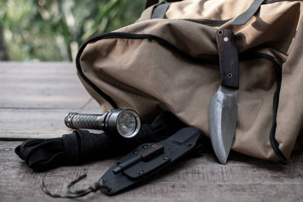 istock A knife with equipment for survival in the forest 1397074023
