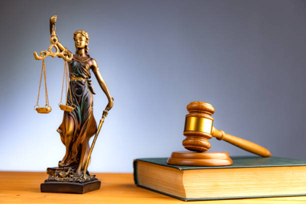 istock Judge hammer, lady justice and books 1397077774