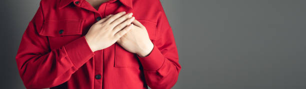 istock woman holds hands on her chest 1397077829