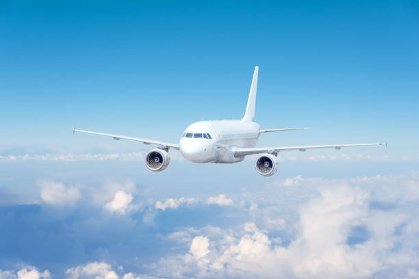 istock Sky cloudy view from above flying white airliner. 1397078856