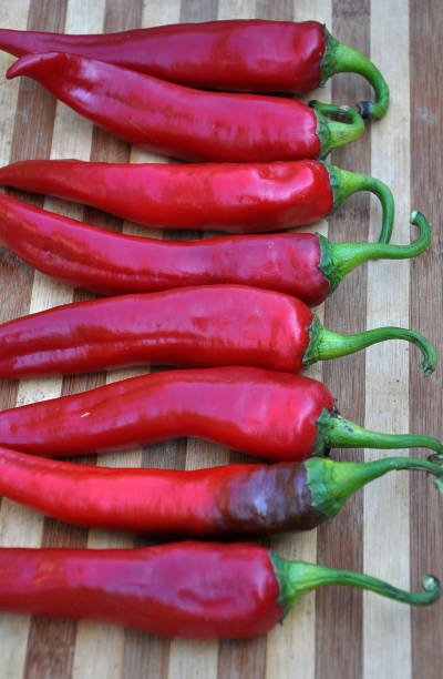 istock Red chili peppers on the kitchen board 1397079871