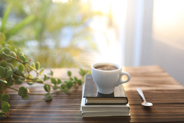 istock Small cup of coffee and notebooks and Peperomia Hope plant 1397080187