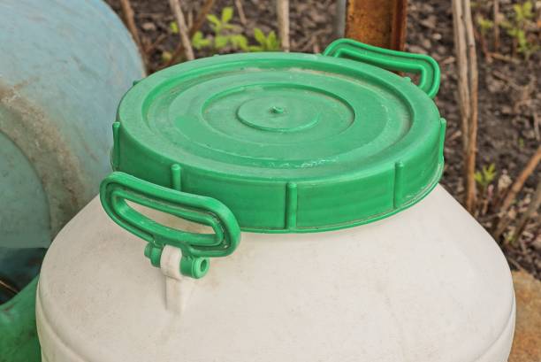 istock one large white plastic barrel closed with a green lid 1397080860