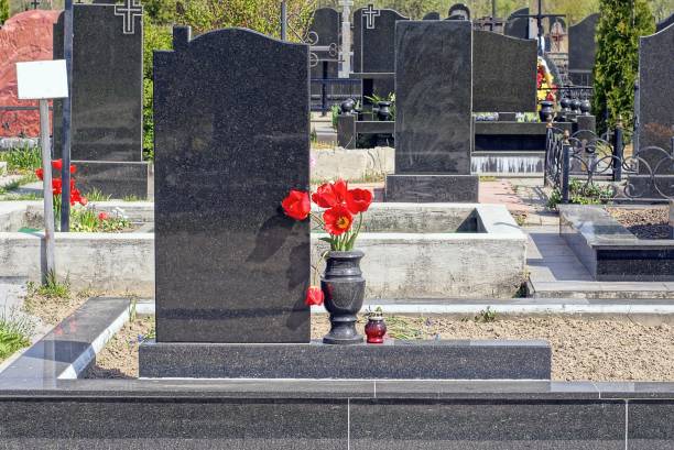 istock one black marble vase with red flowers at a granite monument 1397080939