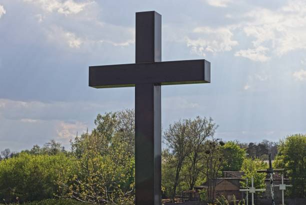 istock one black marble cross on the monument at the grave 1397081041