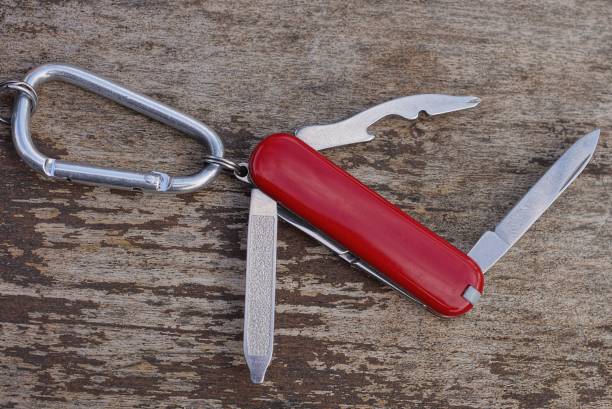 istock one small red open multitool knife with open gray blades 1397081105