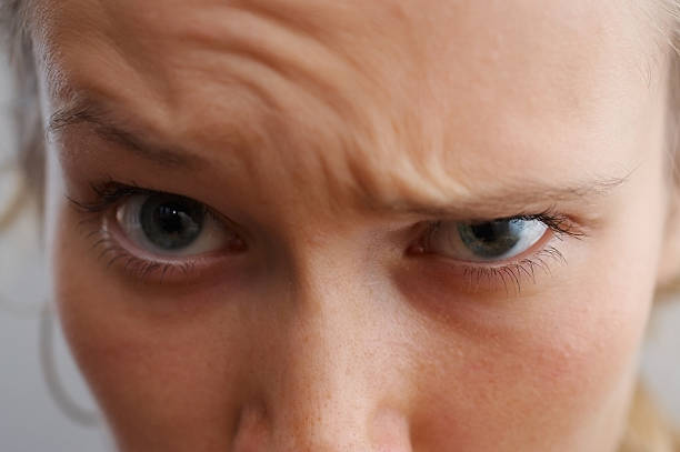 Close-up of a person's wrinkled forehead